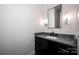 Bathroom features decorative mirror, dark vanity with light countertop and sconces lighting at 139 Poplar Grove Rd, Mooresville, NC 28117