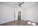Bright, modern bedroom with ceiling fan, closet, and an open doorway to the hallway at 139 Poplar Grove Rd, Mooresville, NC 28117