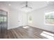 Bright bedroom with two windows, light walls, and a ceiling fan at 139 Poplar Grove Rd, Mooresville, NC 28117