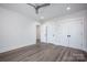 Bedroom features a ceiling fan, recessed lights, and two closet doors at 139 Poplar Grove Rd, Mooresville, NC 28117