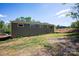Rear exterior view of olive-green siding with regularly spaced square windows, and a lawn at 139 Poplar Grove Rd, Mooresville, NC 28117