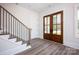Inviting foyer features beautiful flooring and stylish staircase with wood and metal accents at 139 Poplar Grove Rd, Mooresville, NC 28117