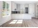 Modern kitchen with stainless steel appliances, sleek white cabinets, and backsplash at 139 Poplar Grove Rd, Mooresville, NC 28117