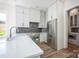 Modern kitchen with stainless steel appliances, sleek white cabinets, and backsplash at 139 Poplar Grove Rd, Mooresville, NC 28117