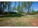 Landscaping features mature trees, mixed grasses and an area of bare soil at 139 Poplar Grove Rd, Mooresville, NC 28117