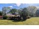Large backyard with mature trees and a lush lawn at 1404 Oakdale Rd, Rock Hill, SC 29730