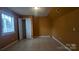 Bedroom with a closet, a window, a light-colored wall, and light-colored tile flooring at 1404 Oakdale Rd, Rock Hill, SC 29730