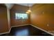 Cozy bedroom with hardwood floors, a window, and a contemporary light fixture creating a calm atmosphere at 1404 Oakdale Rd, Rock Hill, SC 29730