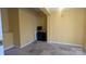 Bedroom with neutral carpeting, yellow walls, and limited amenities at 1404 Oakdale Rd, Rock Hill, SC 29730