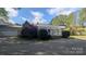 Charming single-story home with a welcoming front porch and well-maintained landscaping at 1404 Oakdale Rd, Rock Hill, SC 29730