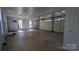 Spacious three car garage featuring overhead doors and windows for natural light at 1404 Oakdale Rd, Rock Hill, SC 29730