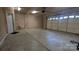 Two car garage with concrete floor and paneled doors and walls at 1404 Oakdale Rd, Rock Hill, SC 29730