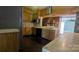 Kitchen featuring a range hood, black appliances, tiled countertops, wood cabinetry, and a dark hardwood floor at 1404 Oakdale Rd, Rock Hill, SC 29730