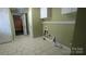 Functional laundry room with washer/dryer hookups and overhead storage space at 1404 Oakdale Rd, Rock Hill, SC 29730