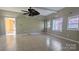 Living room featuring large windows, tiled floors, a ceiling fan, and recessed lighting, creating a bright atmosphere at 1404 Oakdale Rd, Rock Hill, SC 29730