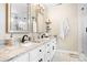 Bright bathroom with double vanity, granite countertops, modern fixtures and large framed mirrors at 141 Rose St, Mooresville, NC 28117