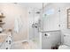 Contemporary bathroom with walk-in shower, white marble tile, and modern fixtures at 141 Rose St, Mooresville, NC 28117