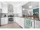 Modern kitchen featuring stainless steel appliances, white cabinetry, and granite countertops at 141 Rose St, Mooresville, NC 28117