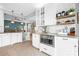 Modern kitchen featuring stainless steel appliances, white cabinets, and an open layout at 141 Rose St, Mooresville, NC 28117