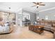 Open concept living room with a kitchen bar, dining area, and comfortable seating creates an inviting atmosphere at 141 Rose St, Mooresville, NC 28117