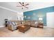 Spacious living room featuring hardwood floors, a ceiling fan, and a comfortable seating area at 141 Rose St, Mooresville, NC 28117