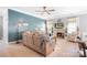 Bright living room with hardwood floors, fireplace, ceiling fan, and comfortable seating arrangement at 141 Rose St, Mooresville, NC 28117