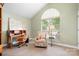 Home office space featuring a desk, chair, and natural light from the arched window at 141 Rose St, Mooresville, NC 28117