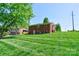 Two-story brick home featuring a spacious backyard and detached garage at 1410 Beverly Ave, Shelby, NC 28152