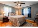 Cozy bedroom with soft lighting, plush bedding, hardwood floors, and ample natural light at 1410 Beverly Ave, Shelby, NC 28152