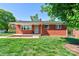 Charming brick ranch-style home with a well-manicured lawn and inviting front porch at 1410 Beverly Ave, Shelby, NC 28152