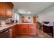 Functional kitchen featuring wood cabinets, an island, and a connected dining area at 1410 Beverly Ave, Shelby, NC 28152