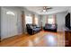 Bright living room featuring hardwood floors, natural light, and a comfortable seating area at 1410 Beverly Ave, Shelby, NC 28152