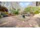 Spacious stamped concrete patio with seating area, sandbox, and trampoline, perfect for outdoor entertaining and play at 1620 Edgefield Ave, Gastonia, NC 28052