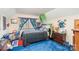 Whimsical Minecraft-themed bedroom with bright blue carpet and playful decor at 1620 Edgefield Ave, Gastonia, NC 28052