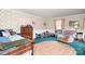 Spacious bedroom featuring a floral wallpaper and a round area rug at 1620 Edgefield Ave, Gastonia, NC 28052