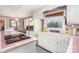 Classic kitchen with pink-tiled countertops and adjacent dining area at 1620 Edgefield Ave, Gastonia, NC 28052