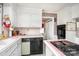 Kitchen with white cabinets and pink tiled countertops at 1620 Edgefield Ave, Gastonia, NC 28052