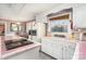 Retro kitchen with white cabinets and pink tile countertops at 1620 Edgefield Ave, Gastonia, NC 28052