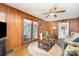 The main living area has wood walls, a ceiling fan, and a glass door leading to an outdoor area at 1620 Edgefield Ave, Gastonia, NC 28052