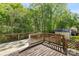 Spacious back deck perfect for entertaining or relaxing outside in a wooded backyard at 1694 Trotters Ridge Rd, Stanfield, NC 28163
