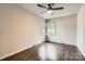 Simple bedroom with wood floors, a ceiling fan and plenty of natural light from the double windows at 1702 Herrin Ave, Charlotte, NC 28205