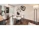 Stylish dining area adjacent to the kitchen with contemporary furniture, hardwood floors, and modern decor at 1702 Herrin Ave, Charlotte, NC 28205