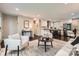 Spacious living area showcasing an open layout, elegant furnishings, hardwood floors and access to the kitchen at 1702 Herrin Ave, Charlotte, NC 28205