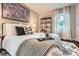 Comfortable main bedroom with decorative pillows, soft rug, and natural light, creating a serene atmosphere at 1702 Herrin Ave, Charlotte, NC 28205