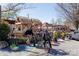 Outdoor dining area of a vibrant restaurant featuring casual seating under thatched roofs at 1702 Herrin Ave, Charlotte, NC 28205