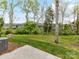 This spacious backyard features lush green grass and plenty of wooded area for privacy at 1805 Axholme Ct, Waxhaw, NC 28173