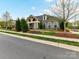 Inviting exterior with stone accents, manicured landscaping, and a welcoming entrance, showcasing curb appeal at 1805 Axholme Ct, Waxhaw, NC 28173