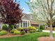 Charming home exterior featuring manicured landscaping and a two-car garage at 1805 Axholme Ct, Waxhaw, NC 28173