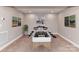 Game room in basement with foosball table and camping themed artwork at 1805 Axholme Ct, Waxhaw, NC 28173