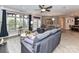 A living room showcases a full view of a large window and sliding doors providing ample natural light at 1805 Axholme Ct, Waxhaw, NC 28173